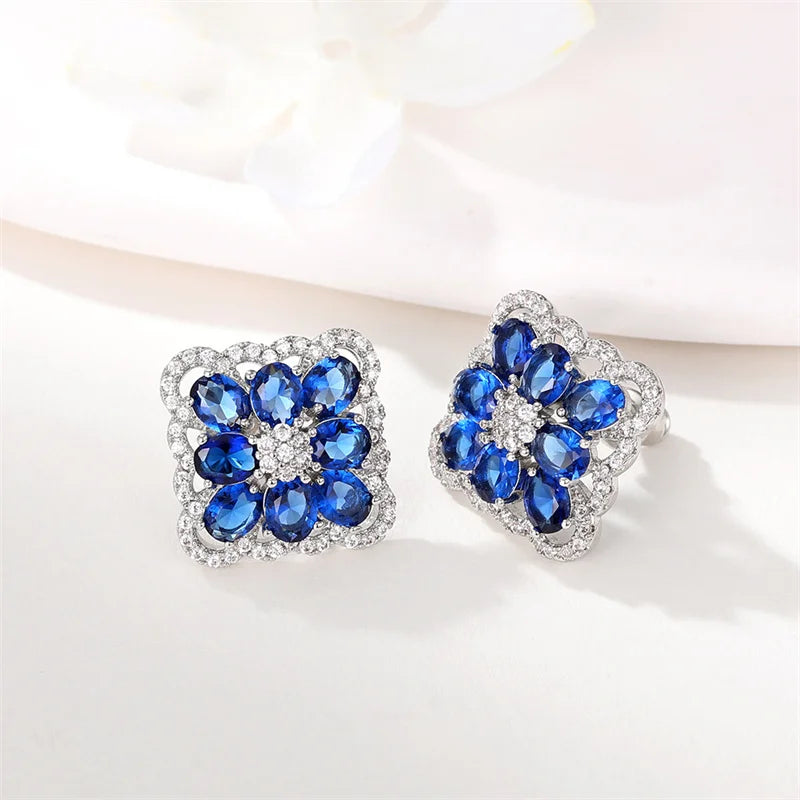 Huitan Silver Cubic Zirconia Stud Earrings – White & Blue CZ