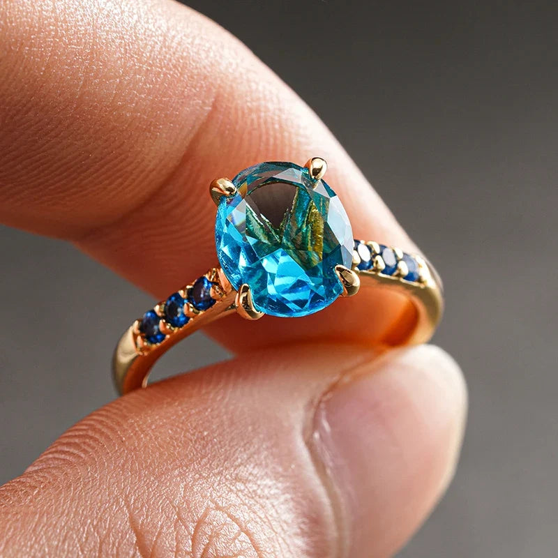 Huitan Sky Blue CZ Oval Ring – Gold Women's Wedding Band